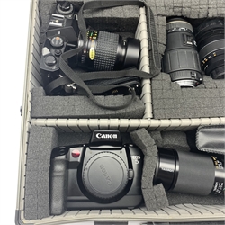  Cameras and accessories comprising a Canon EOS 5 SLR camera, Mamiya SLR camera & flash, Osawa 38-70mm lens, Sigma 70-300mm lens, Tamron 80-120mm lens, Sigma 70-210mm lens, Sigma 18-35mm lens, Photax f2.8 lens, Vivitar flash unit and a Jessops fitted camera case  