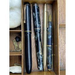 Late 19th/ early 20th century burr walnut work box, early 20th century brass propelling pencil with three inset polished cabochons to sliders, Burnham no. 50 fountain pen with 14ct nib, Conway no 25 pencil, The Croxley Pen and other pens and ephemera 