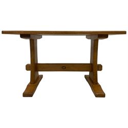 Acornman - oak coffee table, rectangular top on shaped end supports united by pegged stretcher, on sledge feet, carved with acorn signature, by Alan Grainger, Brandsby, York 