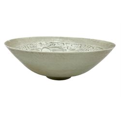 Chinese Ding ware style bowl with inner moulded decoration of figures on raised foot, D20cm