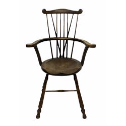 Early 20th century beech country chair, shaped crest rail and spindle back swept arms and circular saddle seat, raised on turned supports united by stretcher W63cm