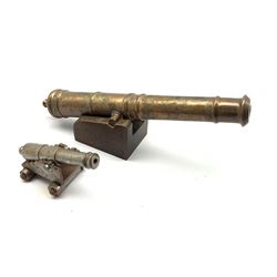 Bronze model of a cannon with tapering barrel on oak trunion L30cm and a steel model cannon L12cm
