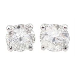 Pair of 18ct white gold round brilliant cut diamond stud earrings, hallmarked, total diamond weight 1.15 carat, with World Gemological Institute Report