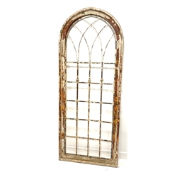 Modern rustic arched window frame, with pine and plywood frame enclosing  metal insert