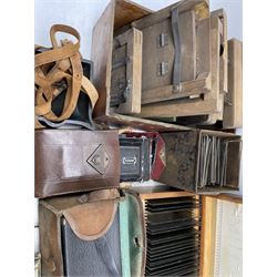 Various cameras and accessories including No. 2 Brownie, Kodak Vollenda 620, other cameras, unused plates, plate holders, plate stands and used plates, developing trays and other developing equipment, small number of lantern slides etc