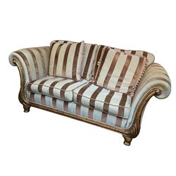 Gascoigne - 'Victoria' two seat sofa, carved and gilt finished wood frame with scrolled arms, the lower upright with carved foliate decoration, upholstered in light blue with brown velvet stripes