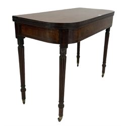 Gillows design mahogany fold over tea table, the fold over top and inlayed frieze, raised on turned and reeded supports, terminating in brass castors 