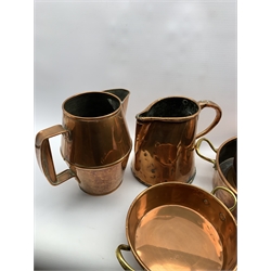 Copper one gallon measure, two copper jugs and two 2 handled pans