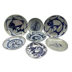 Seven Chinese Provincial blue and white plates, two decorated with carp, two with exotic birds, another with a dragon and other patterns, D23cm max (7)