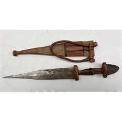 African tribal leather bound bow,  quiver and arrows and a knife in leather sheath