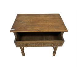 20th century oak side table, rectangular top with moulded edge, fitted with single drawer carved with roundall and foliate decoration, raised on turned supports united by stretcher