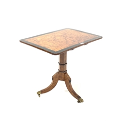 20th century birch tilt top occasional table, the rectangular top with ebonised crossband over octagonal pedestal and three out splayed supports terminating in hairy paw brass castors 