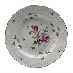 Late 18th century Meissen circular dish, the well finely painted with a floral spray, with a moulded canework border decorated with flying insects, underglaze blue crossed swords mark, D24.5cm