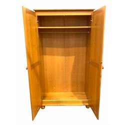 Polished pine double wardrobe, the interior fitted with shelf and hanging rail, (W100cm, H85cm, D53cm) together with a similar three drawer bedroom chest (W45cm, H60cm. D40cm) 