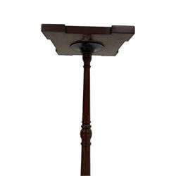 Edwardian mahogany torchere, the recessed square top with moulded edge, raised by a fluted and turned column terminating in a tripod base with splayed supports