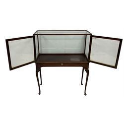 20th century glazed museum display cabinet, enclosed by two doors, raised on cabriole supports with pad feet