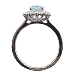 18ct white gold oval aquamarine and diamond cluster ring, hallmarked
