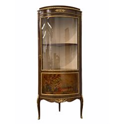 20th century French bow front corner vitrine display cabinet, with gilt metal mounts, glazed door with Vernis Martin style painted panel enclosing three shelves, raised on slender shaped supports with sabot feet H152cm