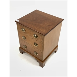 20th century Georgian style mahogany storage box, the hinged lid over three faux drawer front with chequered inlay and brass plate pull handles, raised on shaped bracket supports 