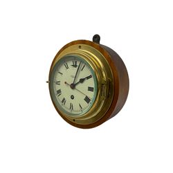 Smiths Astral - 20th-century ships bulkhead clock with an 8-day timepiece movement, with a painted dial, roman numerals, minute track and spade hands and centre seconds sweep hand, within a cast brass bezel mounted on a circular wooden base.