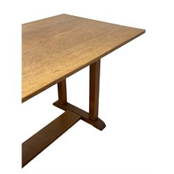 Gordon Russell - circa. 1930s oak refectory dining table, rectangular top over square supports united by trestle base
