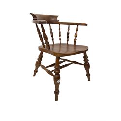 Smokers bow chair, the spindle back over elm seat, raised on turned supports united by a stretcher 