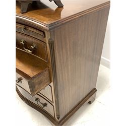 Georgian style serpentine front chest, brushing slide over four graduated drawers, canted and fluted front corners, raised on bracket supports, (W71cm, D46cm, H78cm) together with a mahogany swing mirror fitted with two trinket drawers (W46cm)