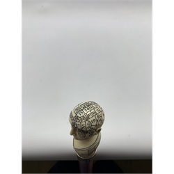 Victorian Phrenology walking cane, Malacca shaft with silver collar and carved ivory phrenology head, the cranium with engraved numbers and divisions showing areas of the sentiments, the key given below, L89cm 