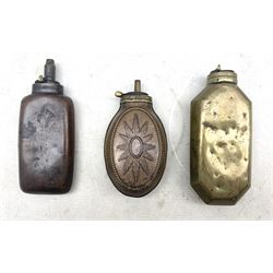Two bottle shaped powder flasks in copper and brass and other powder flask of oval form, L17.5cm max (3)