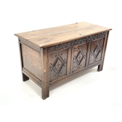 18th Century style oak coffer with moulded top lifting to revel plain interior, 3 panelled front carved with lozenges and raised on stile supports. 