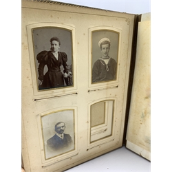 Victorian tooled leather photograph album 'The Seaside Album' with lithographed pages and six air musical movement with key 
