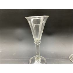 18th century wine glass with rounded funnel shape bowl, plain stem with ball knop on a folded foot H15cm and another with etched bowl and folded foot