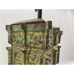 Chinese Han style archaic bronze table lamp with panels of animals, stylised flowers etc on a wooden base H39cm excluding fitting