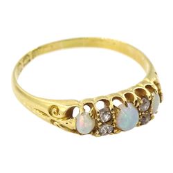 Victorian 18ct gold three stone opal ring, with four diamond accents set between, Birmingham 1896