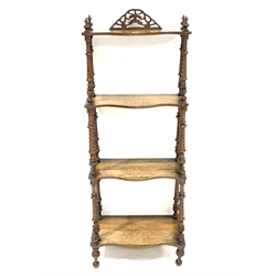 Victorian walnut graduating four tier etagere, each tier serpentine and inlaid with scrolled foliage, twist turned supports, W54cm, H138cm, D32cm