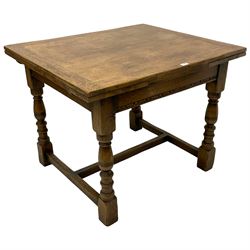Mid-20th century oak draw-leaf dining table, the frieze rails with incised decoration, on turned supports joined by H-shaped stretchers 
