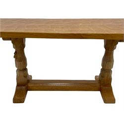 'Mouseman' oak coffee table, rectangular adzed top on octagonal supports, one carved with mouse signature, sledge feet joined by floor stretcher, by Robert Thompson of Kilburn