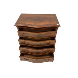 Georgian design mahogany serpentine Bachelor's chest, moulded and cross banded top over slide and four graduating drawers, canted and fluted upright corners, on bracket feet