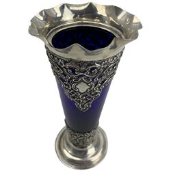 Late Victorian silver overlaid blue glass trumpet shape vase with crimped rim, embossed and pierced decoration on a stepped circular foot H18cm Birmingham 1898 Makers mark J.R.Ld