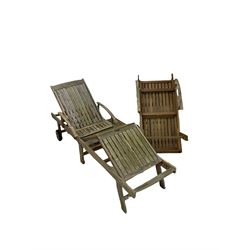 Two wooden sun loungers