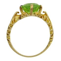 18ct gold oval peridot ring with leaf design gallery and shoulders 