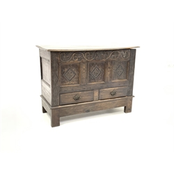  18th century oak mule chest, plain hinged lid with moulded edge above scroll carved frieze and three carved and fielded panels, two drawers under, on stile supports, W128cm  