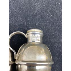 Pair of white metal salt and pepper pots in the form of Guernsey milk jugs, stamped silver, boxed
