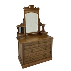 Oak dressing chest, swing mirror back with two trinket drawers, above two short and two long drawers, raised on a plinth base