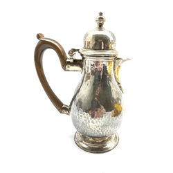 Late Victorian Britannia standard hammered silver baluster hot milk jug with domed cover, stained wooden handle and short pedestal foot H16cm London 1897 Maker Joseph Heming 9.7oz gross  