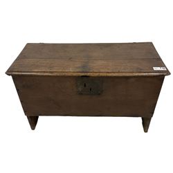 18th century oak coffer or chest, hinged rectangular two-plank top with moulded edge, enclosing candle box and main compartment, raised on end supports