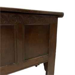 17th century oak six plank coffer or chest, rectangular hinged top with moulded edge enclosing candle box, the frieze carved with repeating concentric lunettes with foliate detail over triple panelled front
