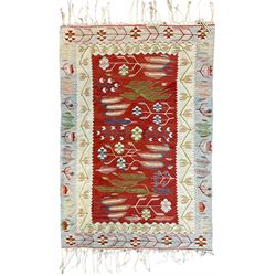 Turkish Kilim ivory and crimson ground rug, the field decorated with wheat ear design and stylised flower heads, the pale indigo and ivory borders with trailing tulip patterns, with raised braiding 