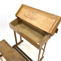 Mid 20th century child's school desk, raised back over ink well recess and pen wells, sloped front revealing storage area, connected to an integral bench seat, with traces of original blue paint,  W75cm, H78cm, D66cm