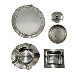 Small silver circular salver with pierced border D18cm Birmingham 1930 Maker Barker Brothers Silver Ltd., two silver ashtrays, silver small saucer dish and a silver lid 16oz (5)